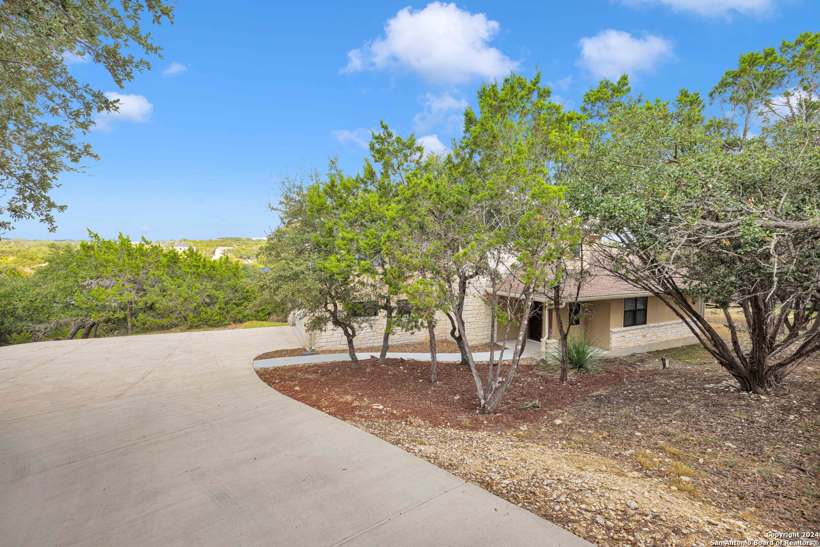 a view of a house with a tree