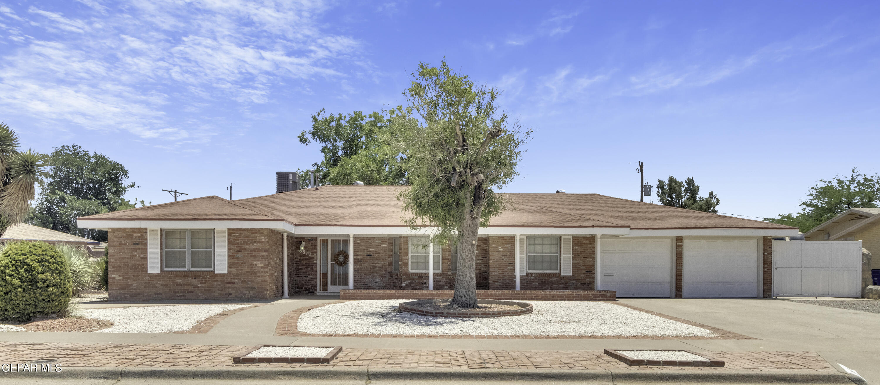 a front view of a house with yard