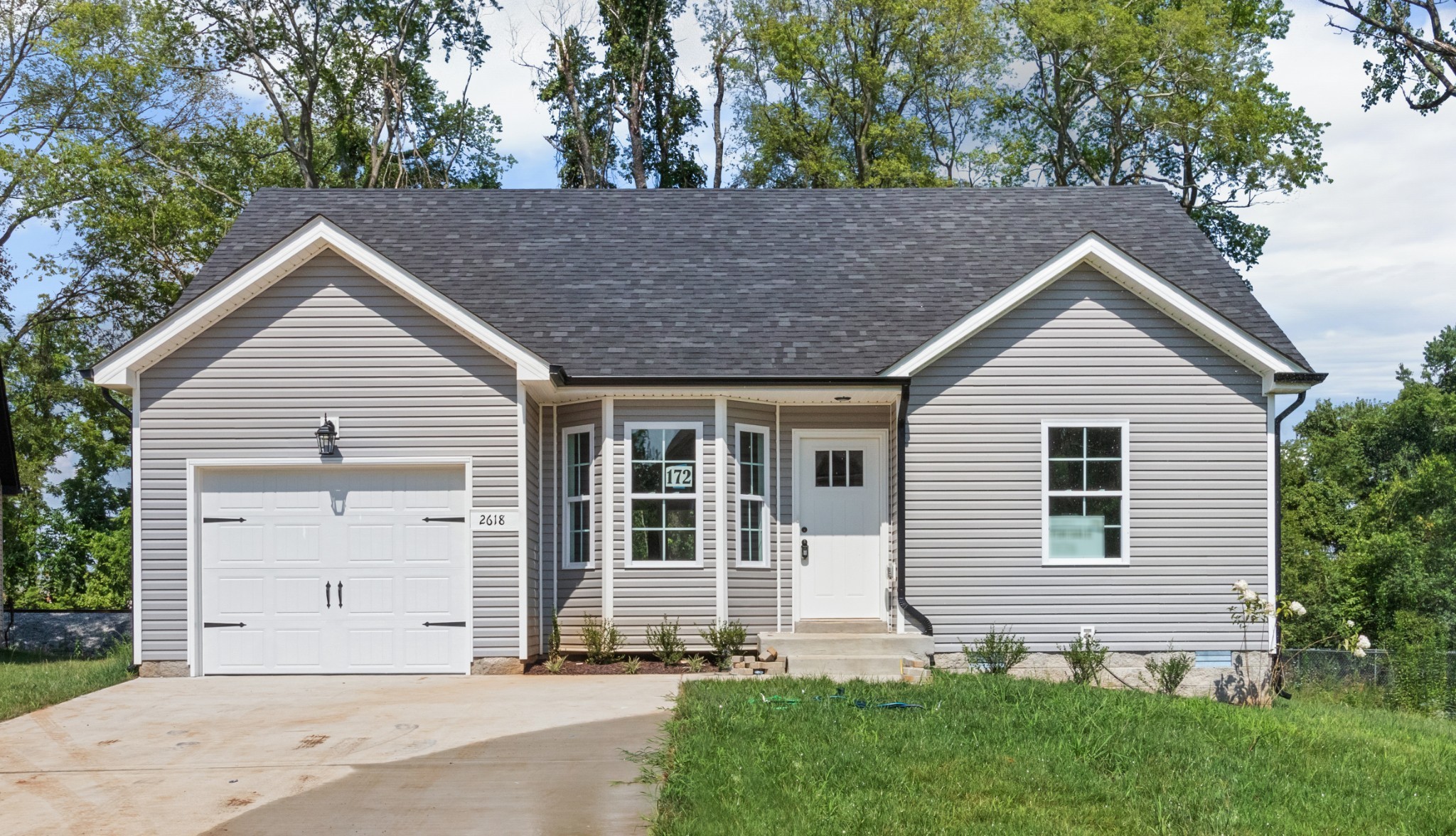 a front view of a house with a yard