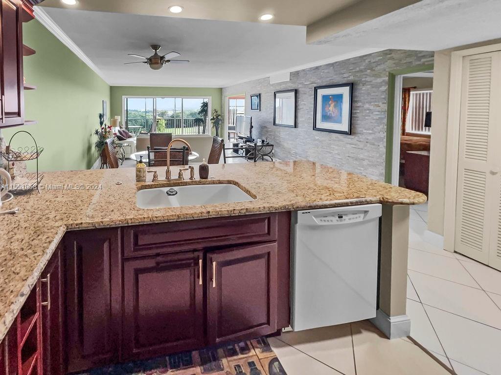 a view of living room with granite countertop furniture and fireplace