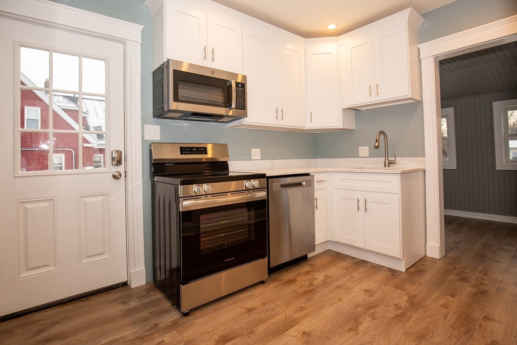 a kitchen with a stove and a microwave