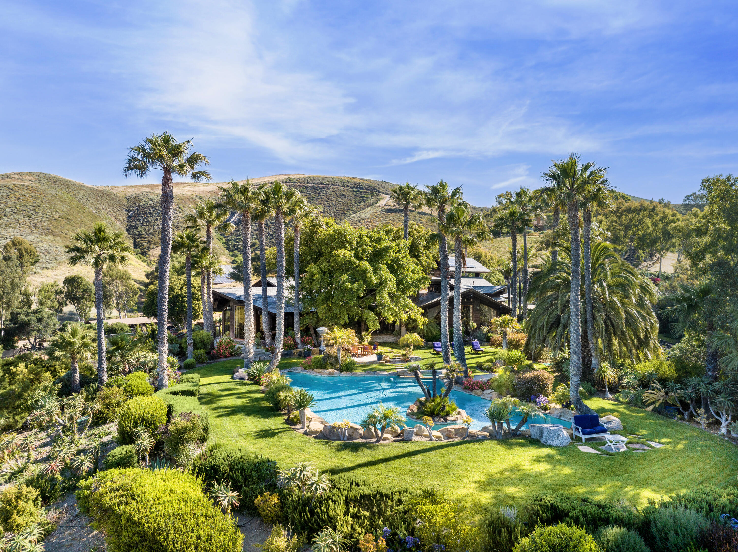 a view of a yard with swimming pool