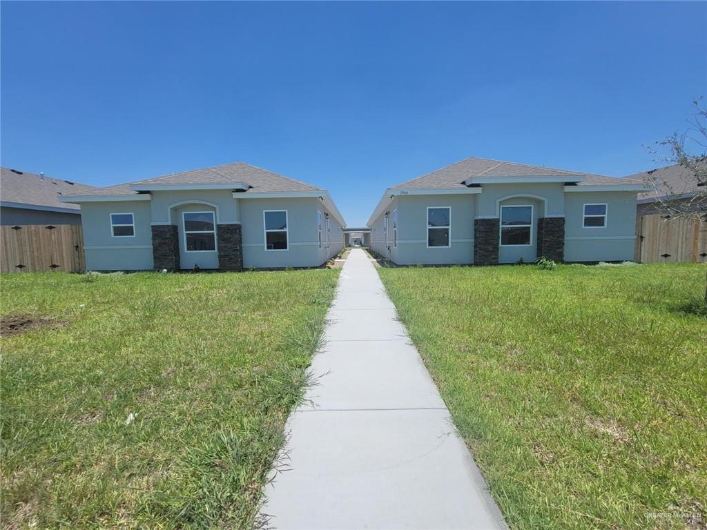 a front view of a house with yard