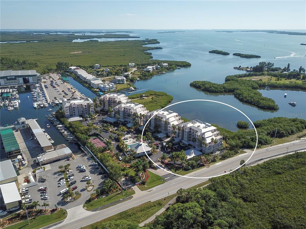 an aerial view of ocean residential house with outdoor space and seating area