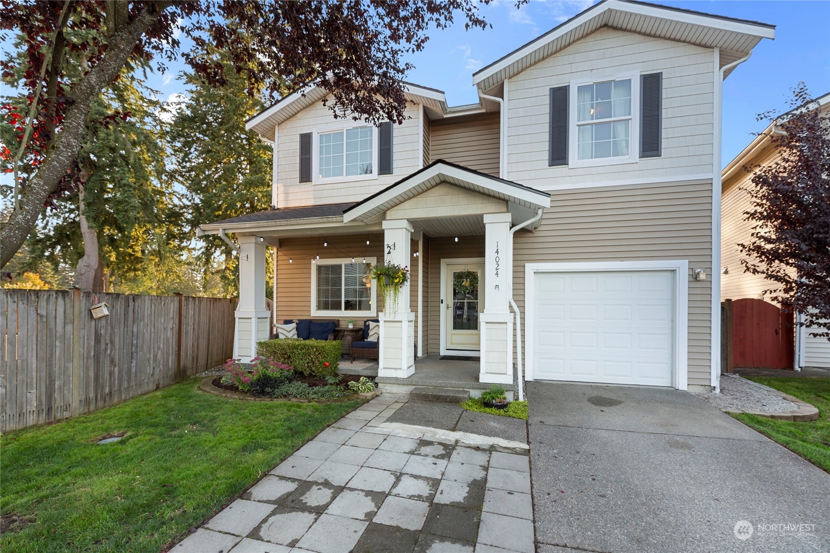 a front view of a house with garden