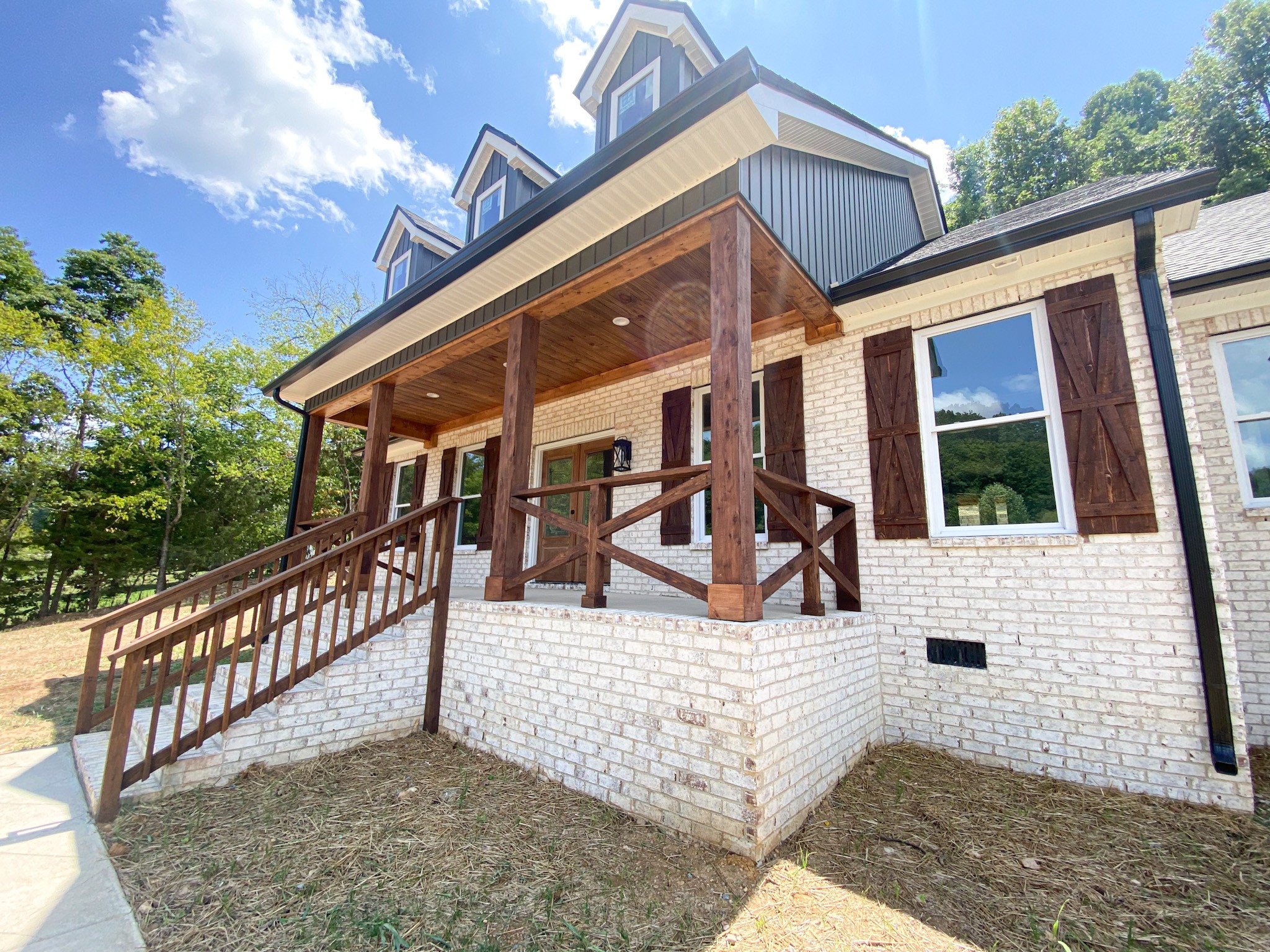 a view of house with a patio and dining space