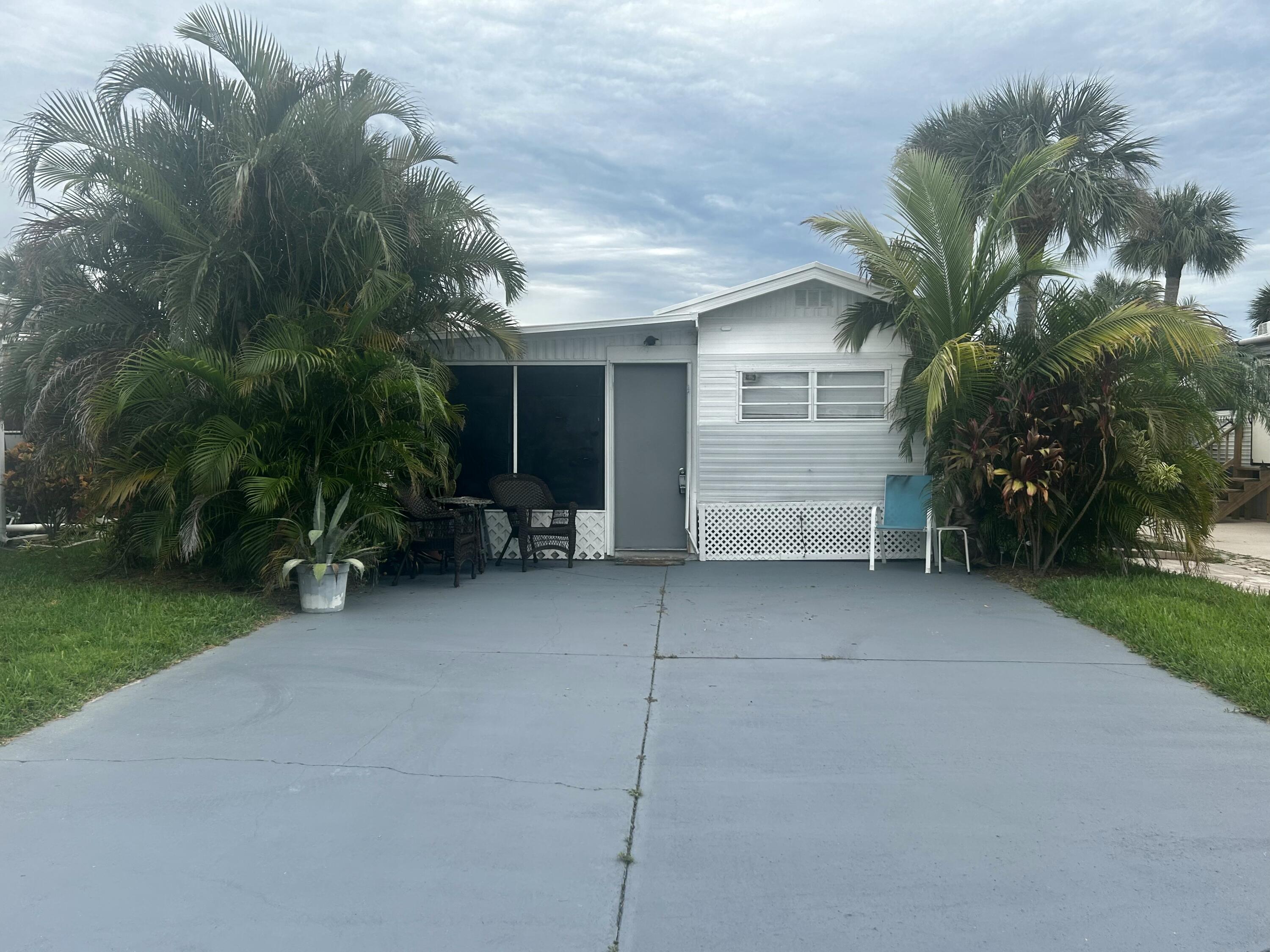 a view of house with outdoor space and garden