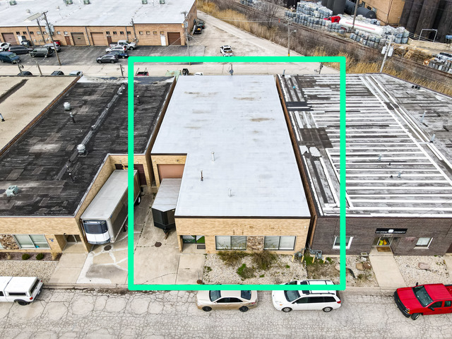 an aerial view of a houses with outdoor space