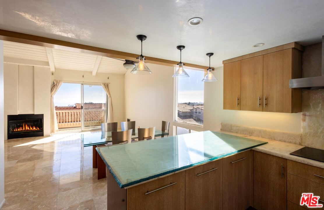 a open kitchen with stainless steel appliances granite countertop a sink and a refrigerator