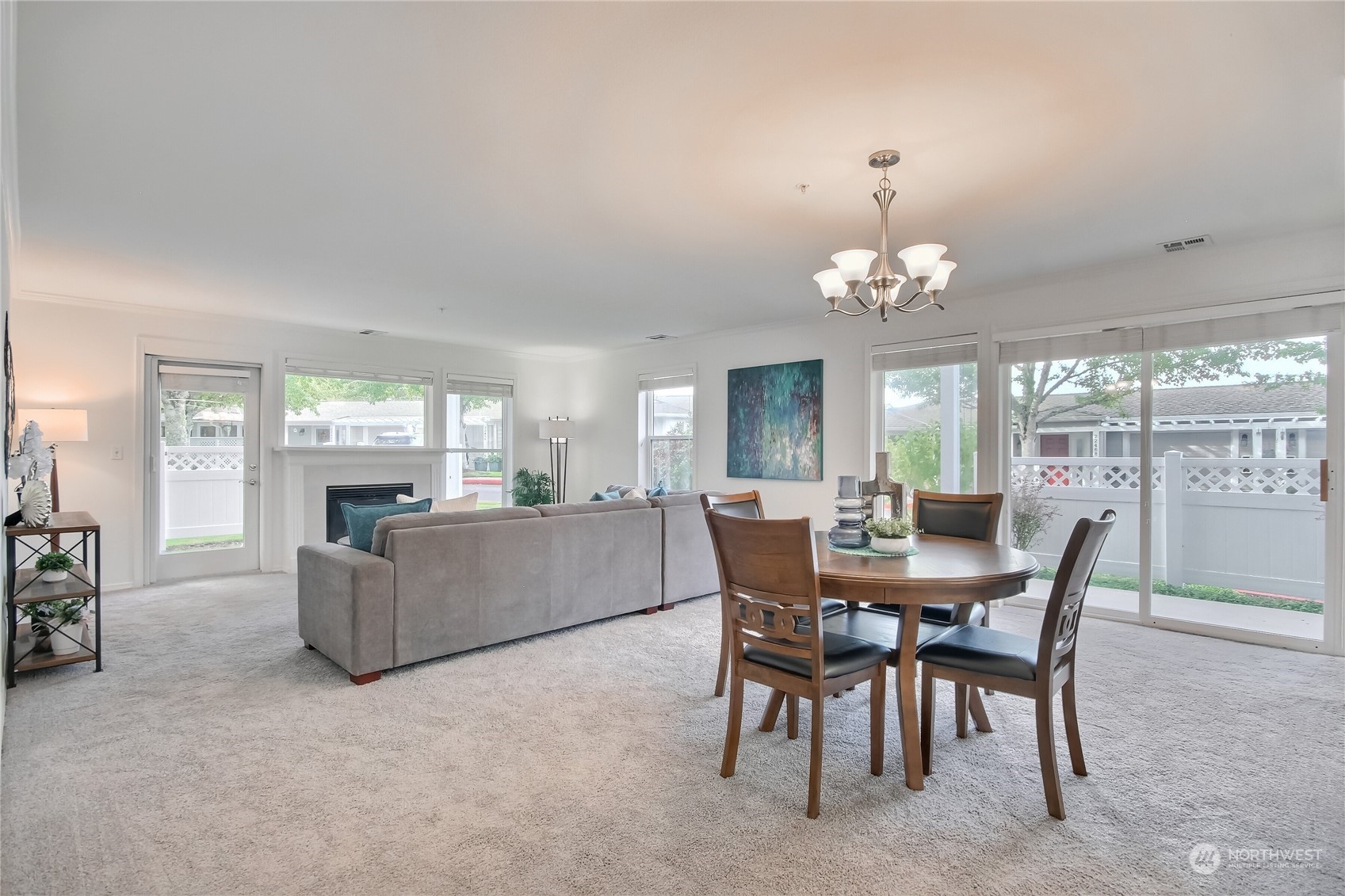 a dining room with furniture a livingroom and chandelier