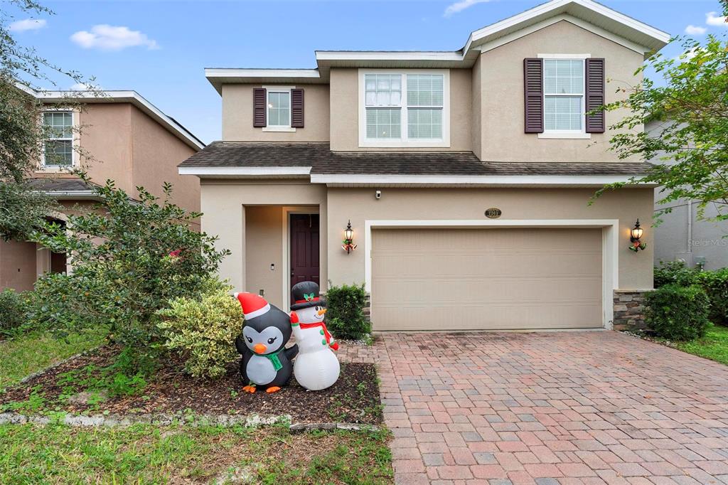 a front view of a house with a garage