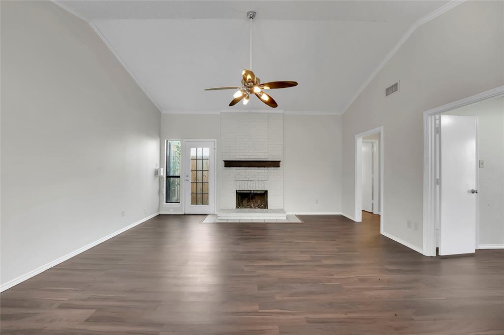 a view of a room window and wooden floor