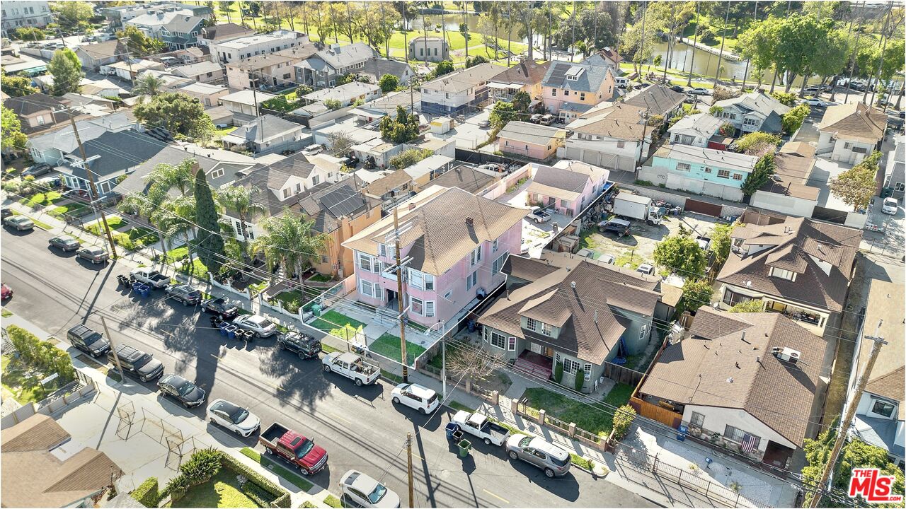 an aerial view of residential houses with outdoor space