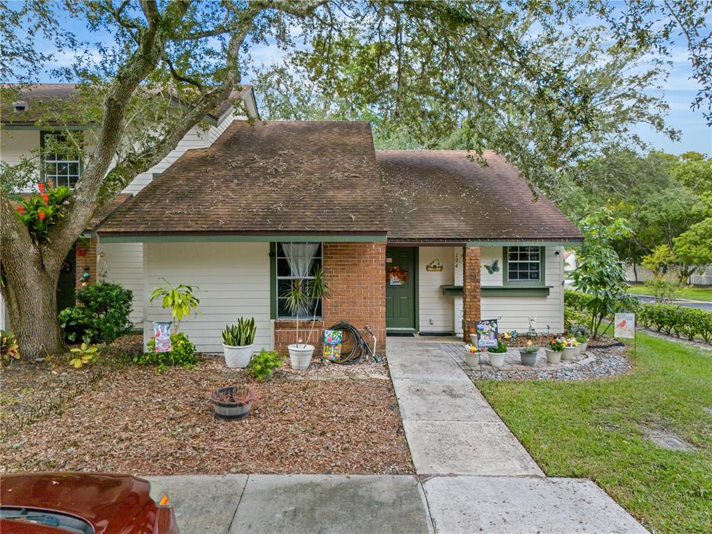 a front view of a house with garden