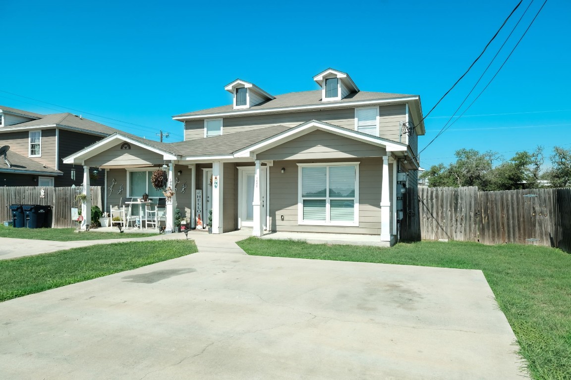 a front view of a house with a yard