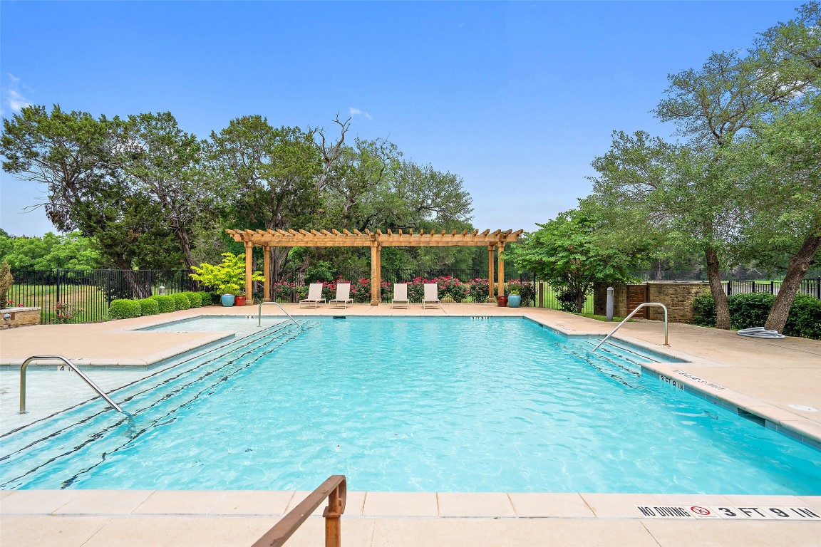 a view of a swimming pool with a patio