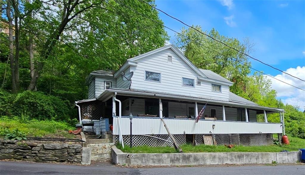 a front view of a house with a porch