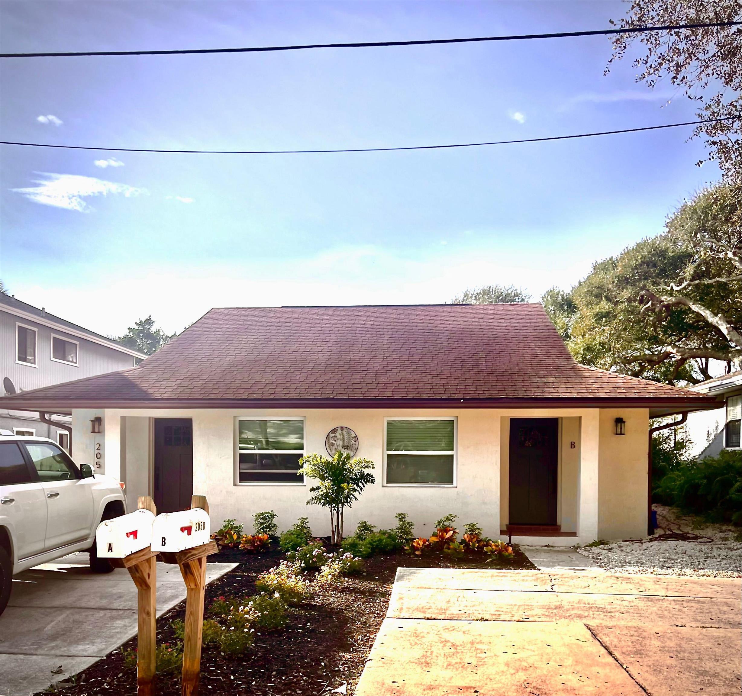 a front view of a house with sitting space