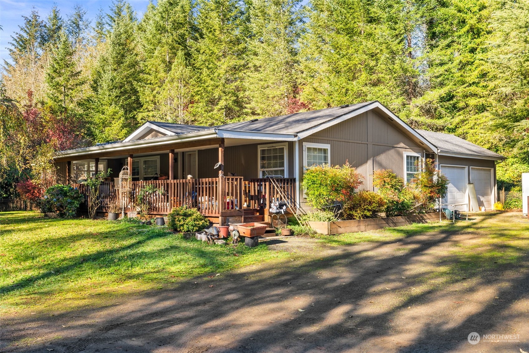 a view of a house with a yard patio and fire pit