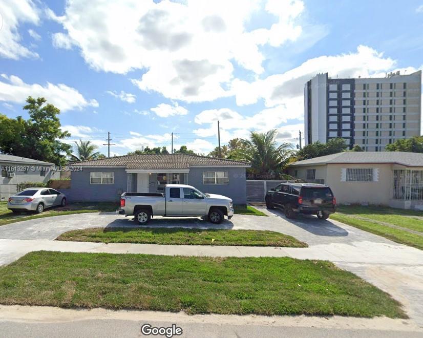 a car parked in front of a house