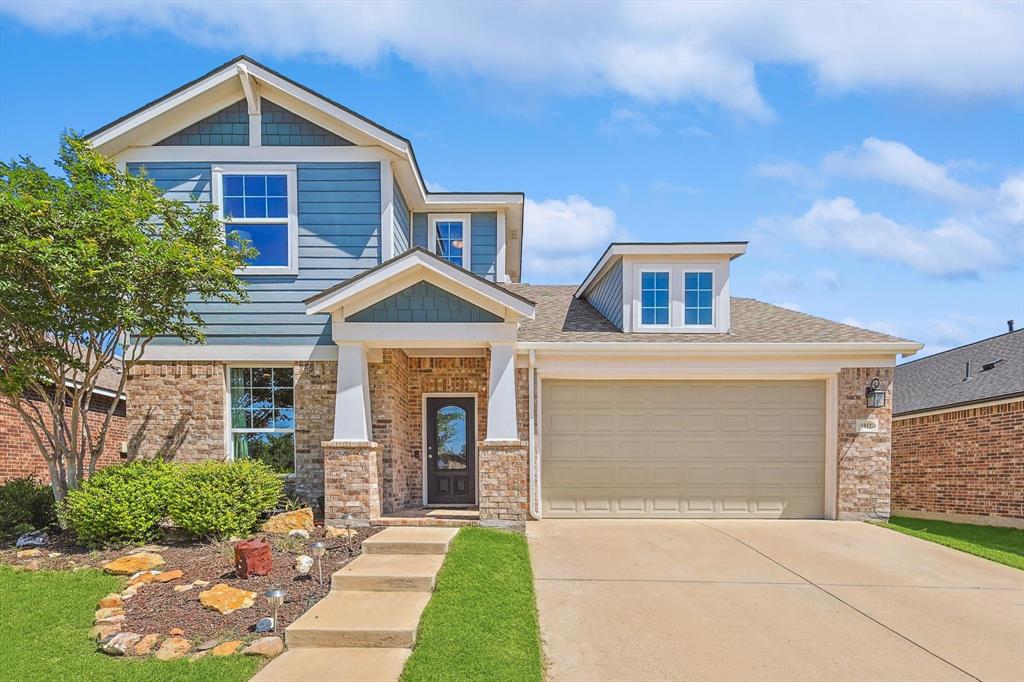 a front view of a house with yard