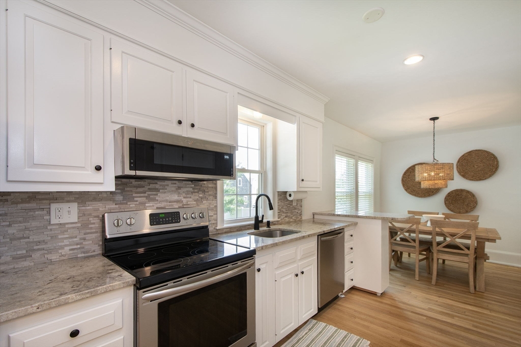 a kitchen with a stove and a microwave