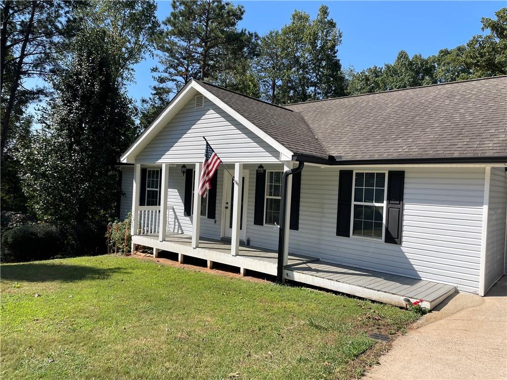 a view of a house with backyard porch and garden