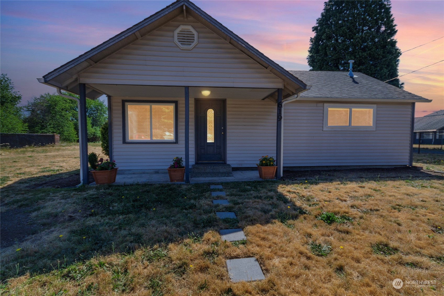 a front view of a house with garden