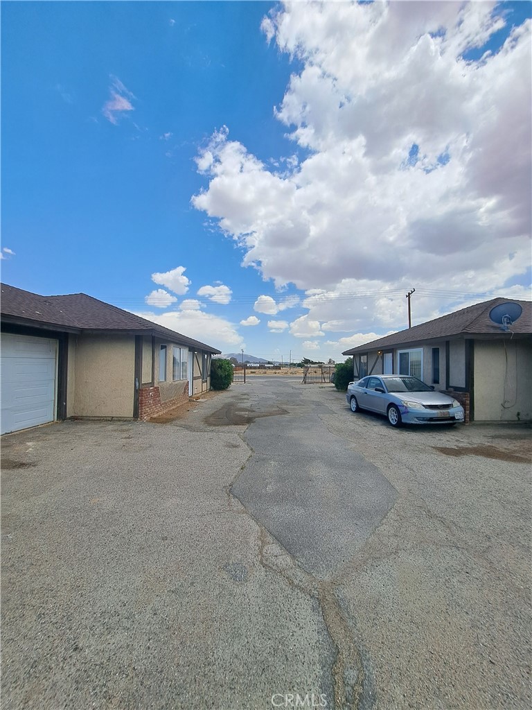 a view of a house with a road