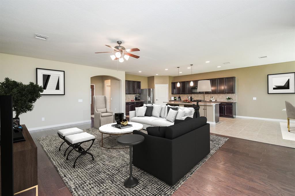 The living room is open to dining and the kitchen.Virtually Staged