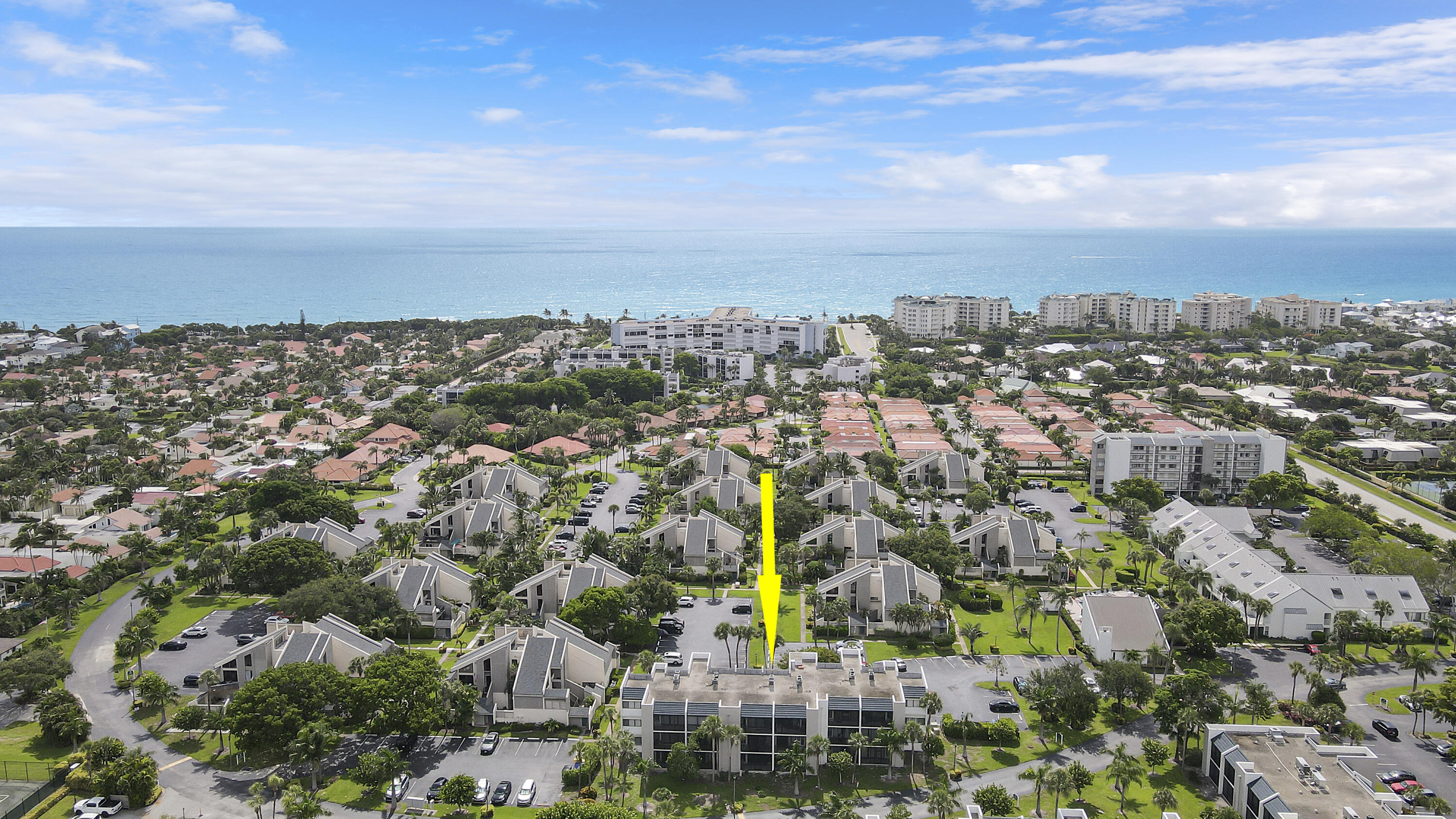 an aerial view of residential building and trees around