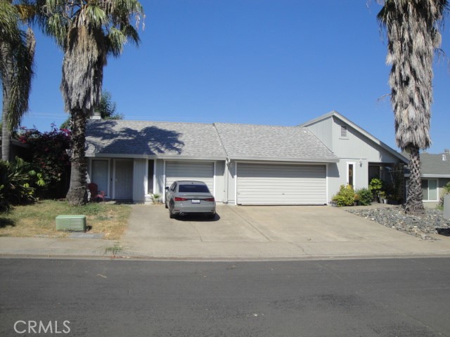 a view of a house with a yard and garage