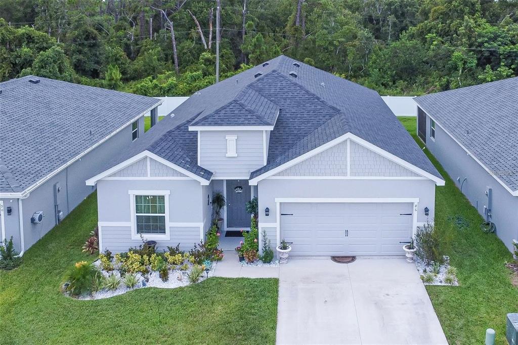 a aerial view of a house with garden