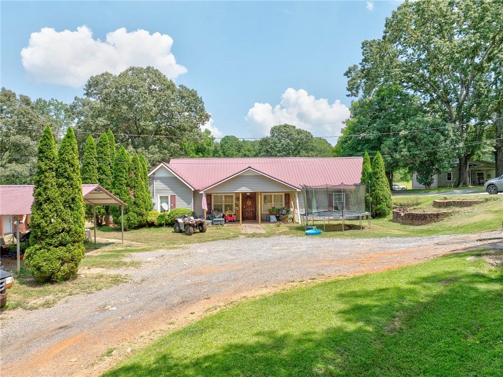 a front view of a house with garden