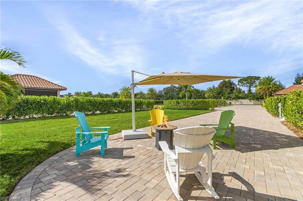 a view of a chairs and table in the garden