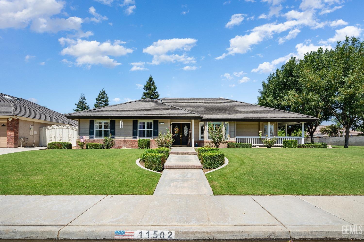 a front view of a house with yard