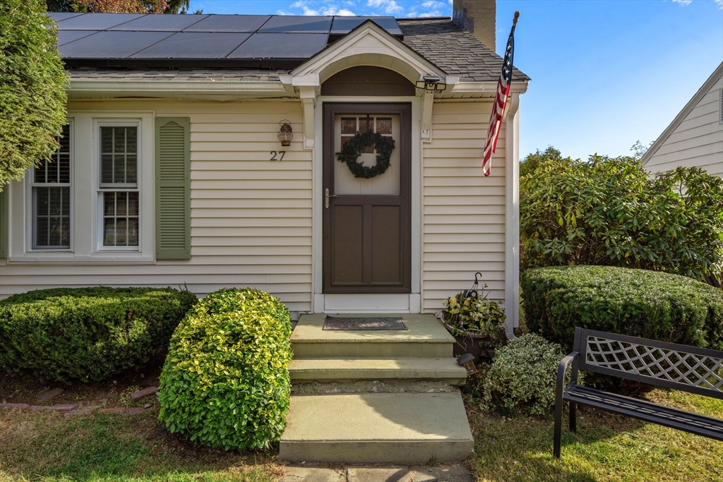 a front view of a house with garden