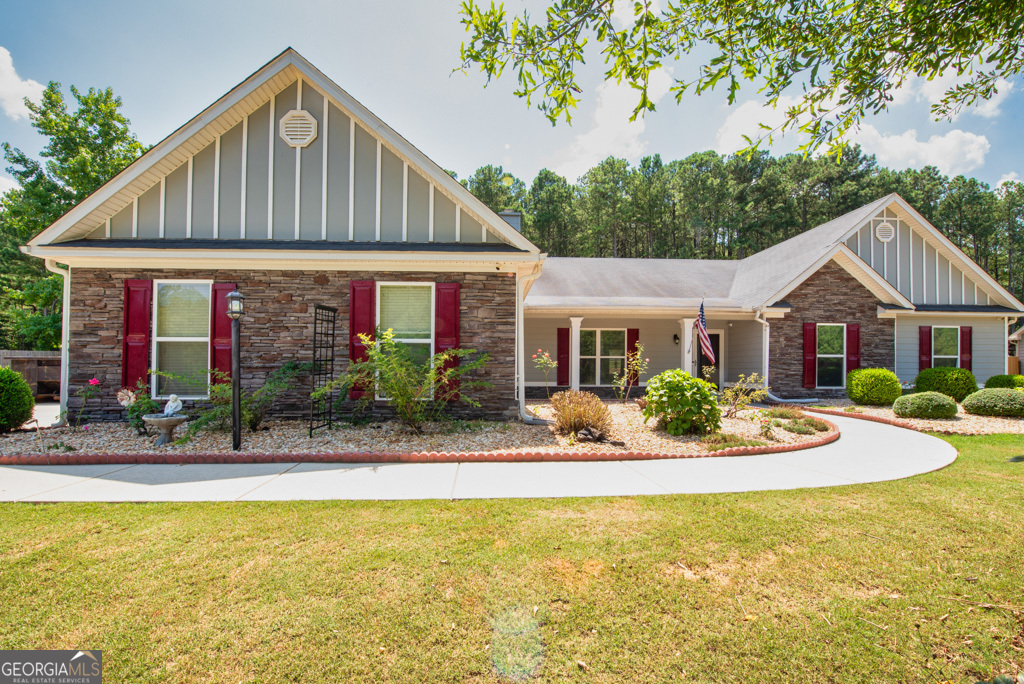 a front view of house with yard and green space