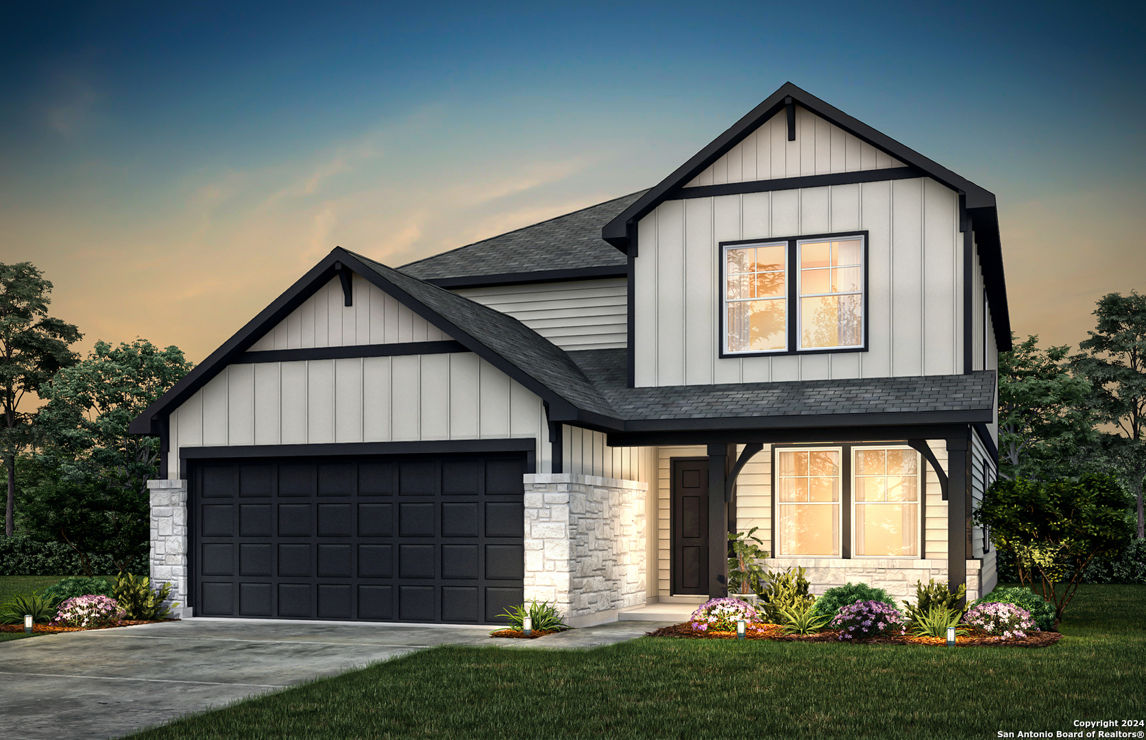 a front view of a house with a yard and garage