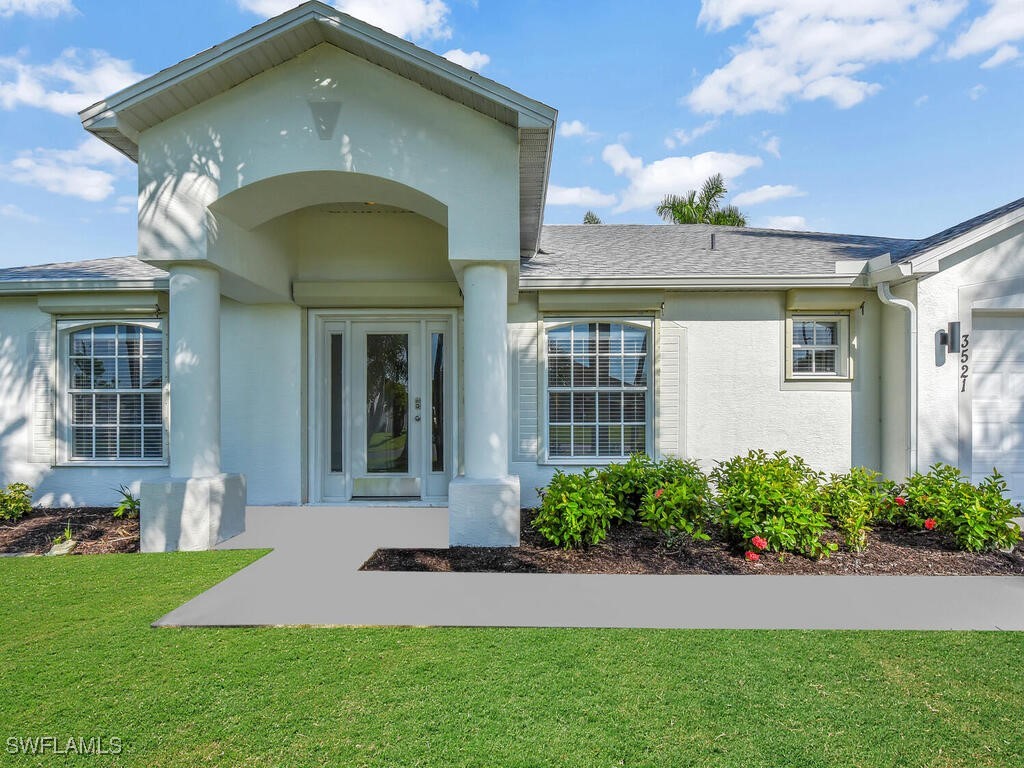 a front view of a house with a yard