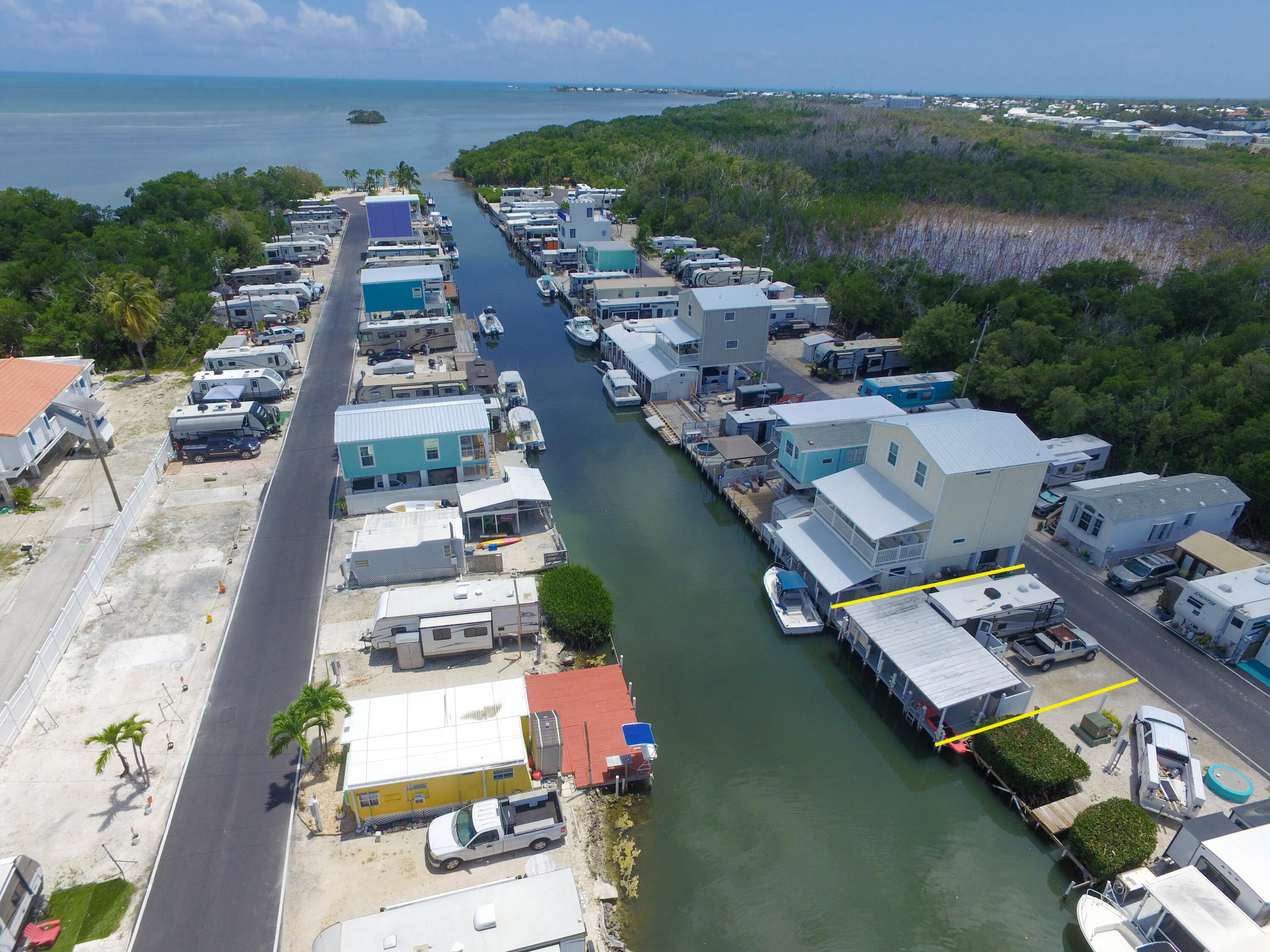 an aerial view of a house with a lake view