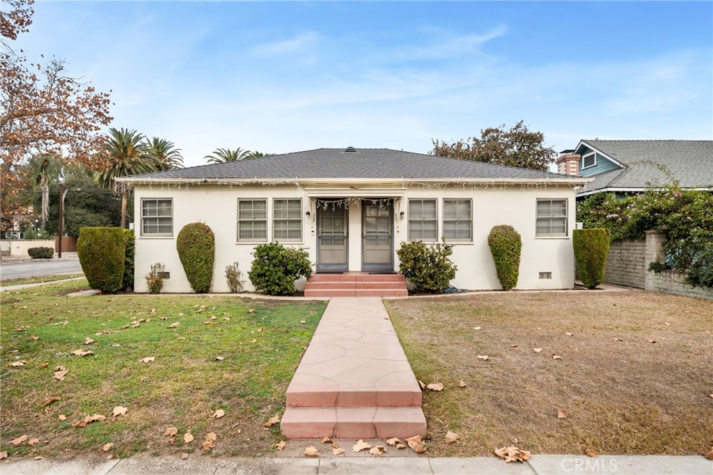 front view of a house with a yard