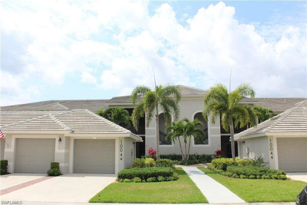 View of front of home featuring a garage and a front lawn