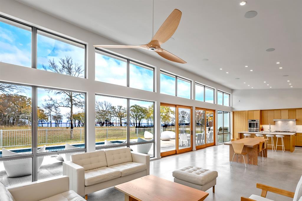 a lobby with furniture and floor to ceiling window