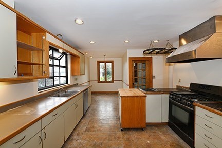 a kitchen with a stove and a sink