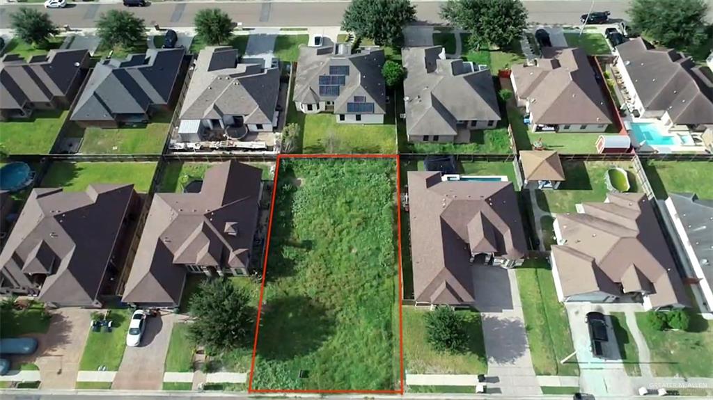 an aerial view of multiple houses with yard