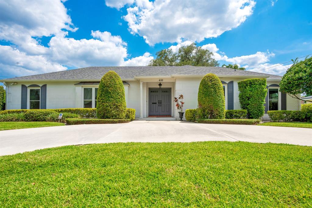 front view of a house with a garden