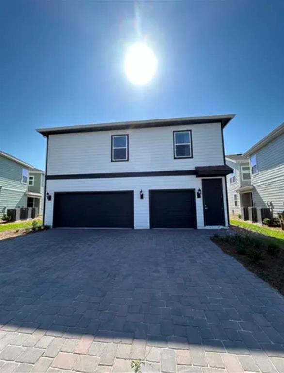 a front view of a house with yard