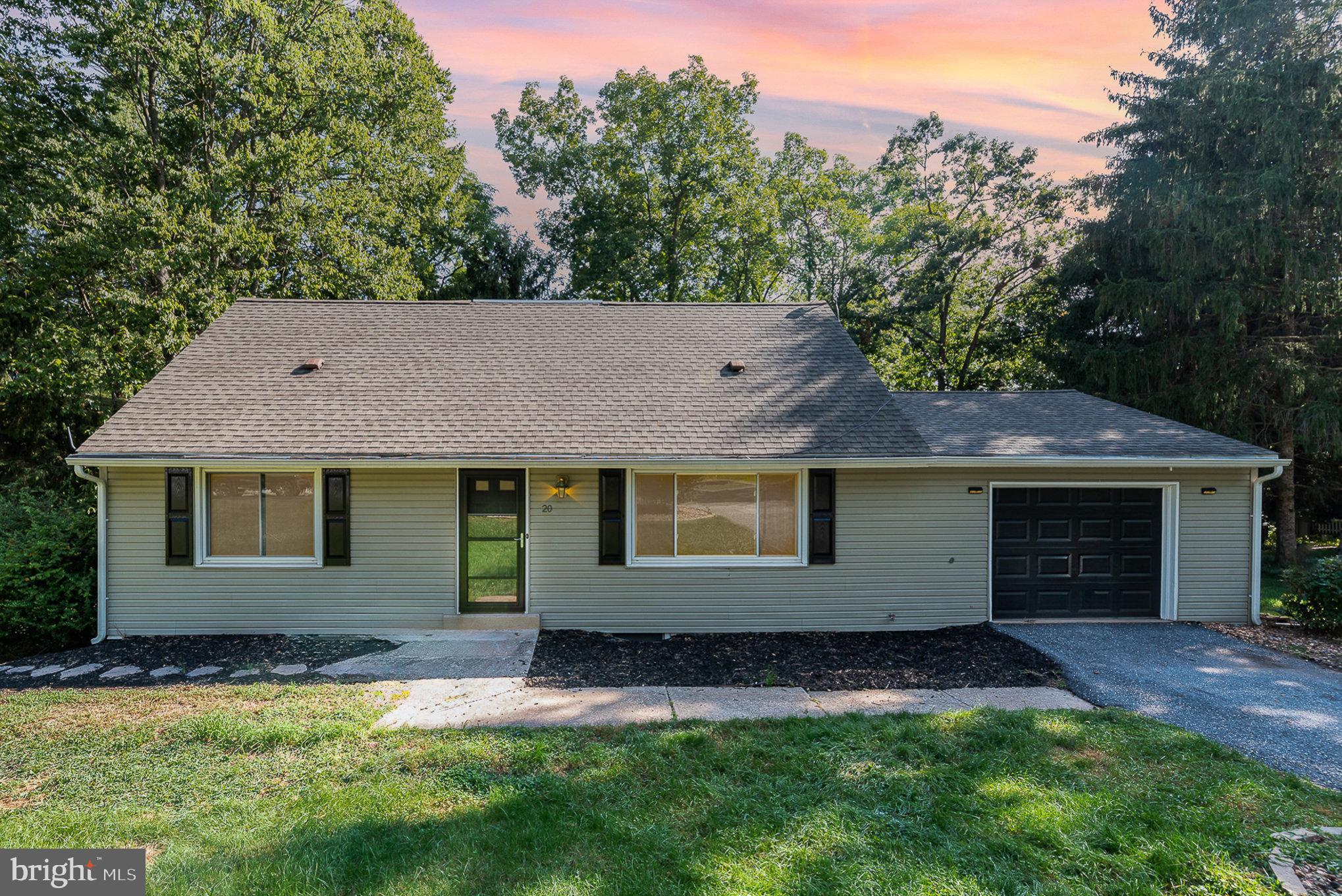 front view of a house with a yard