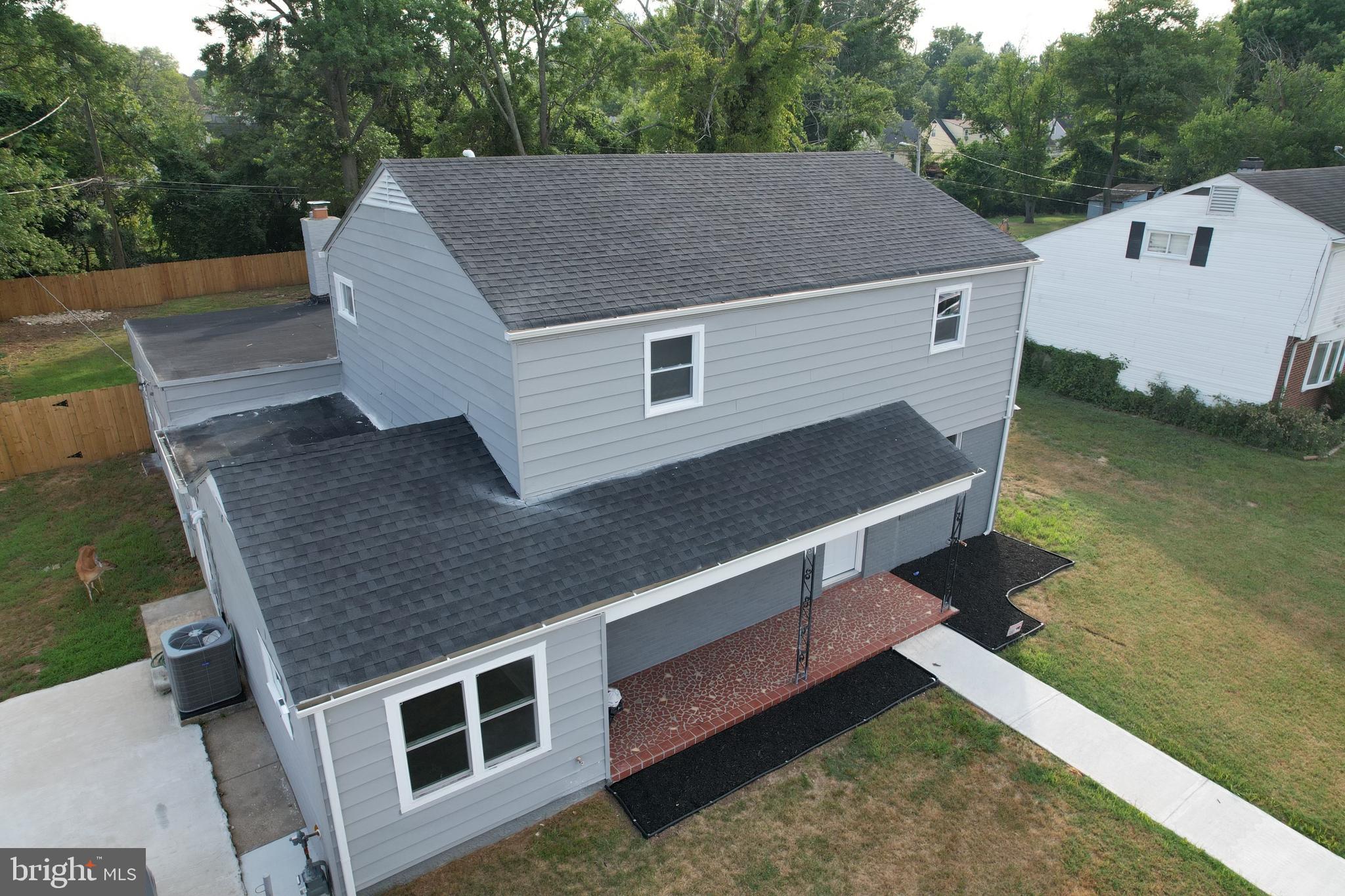 a aerial view of a house with a yard